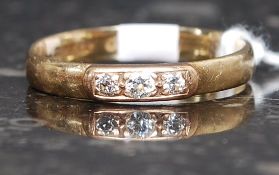 A ladies 9ct gold and diamond ring inset 3 channel set diamonds approx 5pnts total.