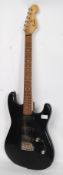 An electric six string right handed stratocaster style guitar by encore