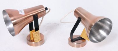 A pair of 1960's copper / aluminium wall lights, both with original labels. Unused.