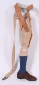 A vintage mid 20th century medical Prosthetic leg complete with foot having applied shoe and sock