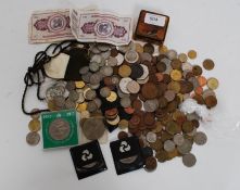 A collection of coins from around the world to include British,