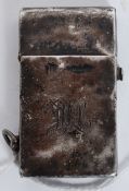 A sterling silver petrol lighter, having hinged lid with lighting mechanism built into the lid.