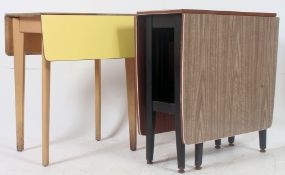 A 1950's retro yellow formica drop leaf dining table together with a formica faux wood gateleg