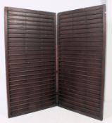 An unusual large wooden industrial style folding dressing screen.