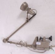 A vintage industrial Lumina Brevett industrial anglepoise style clamp on work lamps.