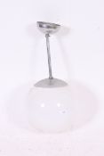 A retro 1970's large milk glass globe shade ceiling light complete with chrome arm bracket