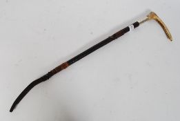 A  leather and silver hallmarked collar riding crop with bone handle.