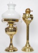 Two vintage 20th century brass oil lamps, one with original gallery, chimney and shade.