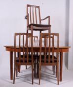 A set of good quality 1970's teak dining chairs having railed backs ( 5 total ) together with a