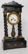 A mid 19th century French Portico clock having and architectural canopy inlaid with foliate designs