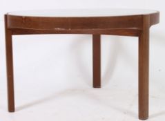 A retro Danish style teak round glass topped coffee table with shaped supports.