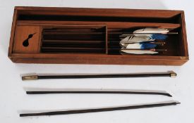 A rare and interesting 19th century Japanese childs archery set complete in the box.