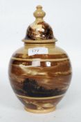 A lidded studio pottery vase bearing stamps to base,