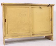 A good mid 20th century shabby chic painted school cupboard.