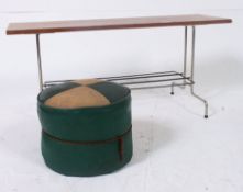 A retro metal / chromed  legged coffee table having teak top raised above a magazine rack along