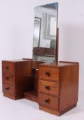A 1940's utility drop centre oak dressing tables chest of drawers.