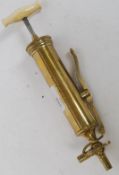A 19th century Brass Syringe Labelled ' Coxeter-Maker' 23 Grafton St, East London.