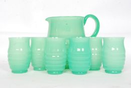 A stunning 1930's Art Deco green ribbed glass lemonade set.