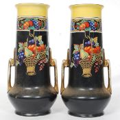 A pair of Art Potter Argent art nouveau style decorative ceramic vases.