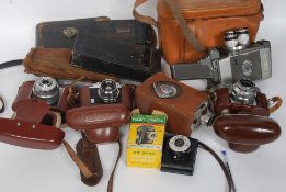 A good collection of vintage 35mm cameras, folding cameras, cine cameras to include Voightlander,