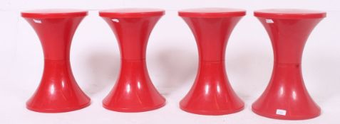 A set of 4 retro stacking 1970's plastic Tam Tam stools of inverted tapering barrel form