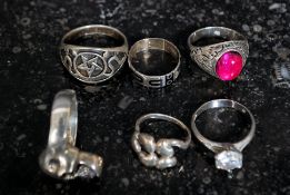 A collection of 5 silver earrings to include skull, symbols, claw mounted stone set,