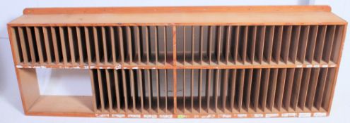 A large  vintage 1950's Industrial pigeon hole stationary cabinet having plain sides with fitment