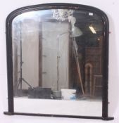 A large Victorian aesthetic movement dome top overmantel mirror.