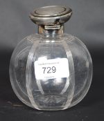 An excellent Art Deco silver and cut glass bulbous ladies perfume bottle.