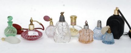 A collection of twelve vintage and later perfume bottles to include cut glass, coloured glass,