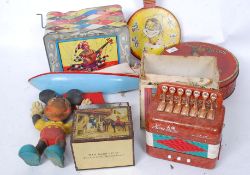 A collection of vintage toys and tins to include Jack In The Box, Banjo, Hero Accordion,
