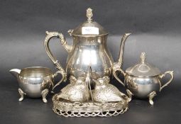 A silver plate tea service consisting of teapot,