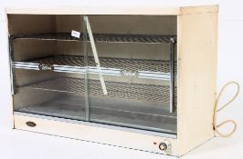 A vintage 1970s's Belling enamel Industrial pie warmer cabinet having white exterior with notation