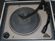 A vintage two tone Murphy portable four speed record player,