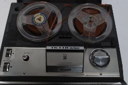 A Grundig De Luxe reel to reel retro vintage tape player.