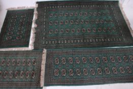 A collection of matching floor rugs / carpets of various sizes,