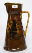 A large early 20th century Royal Doulton  jug of Art Nouveau form having sailing ship decoration.