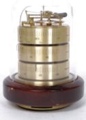 A vintage / retro brass German ? weather station barometer all set under a glass dome,