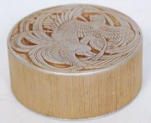 A Fleur D'amour aluminium powder box designed by R.