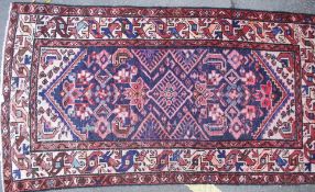 A good Persian Islamic rug having central large medallion design with beige geometric pattern
