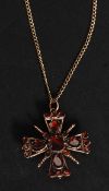A 19th century 9ct gold ( tested ) ruby garnet Maltese cross pendant necklace,