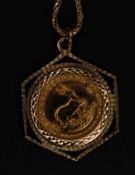 A 1/10 oz Krugerrand gold coin set in gold 9ct clasp set to a 9ct gold chain ( see illustrations )