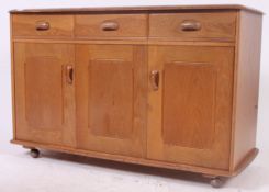 A vintage 1970's retro pale oak sideboard in the Ercol style, likely by Priory.
