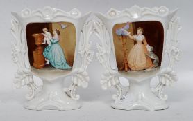 An unusual pair of Victorian twin handled creamware spill vases,