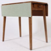 A 1950's retro green formica and beech wood kitchenette dining table.