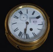 A good brass ships bulkhead clock having enamel painted metal face with subsiduary seconds dial,