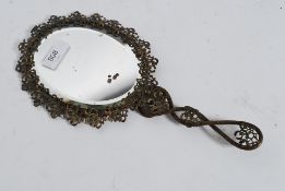 A vintage mid century gilt metal rococo ladies hand mirror.