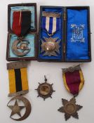 A group of silver medals of eastern military interest complete with ribbons and presentation boxes.