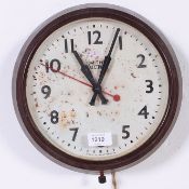 A vintage mid century retro Smiths bakelite electric wall clock having circular body with black and