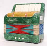 A vintage Chinese made ' Hero ' small squeeze box / accordion.